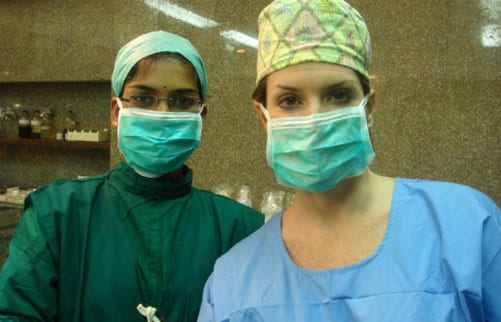With the surgical assistant in the operating room at the Bombay Hospital
