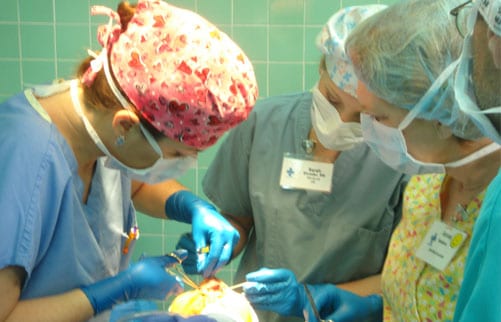 Dr. Jennifer Walden and her nurse, Sarah Shrader, operating during a 2008 medical mission trip to El Salvador with Austin Smiles.